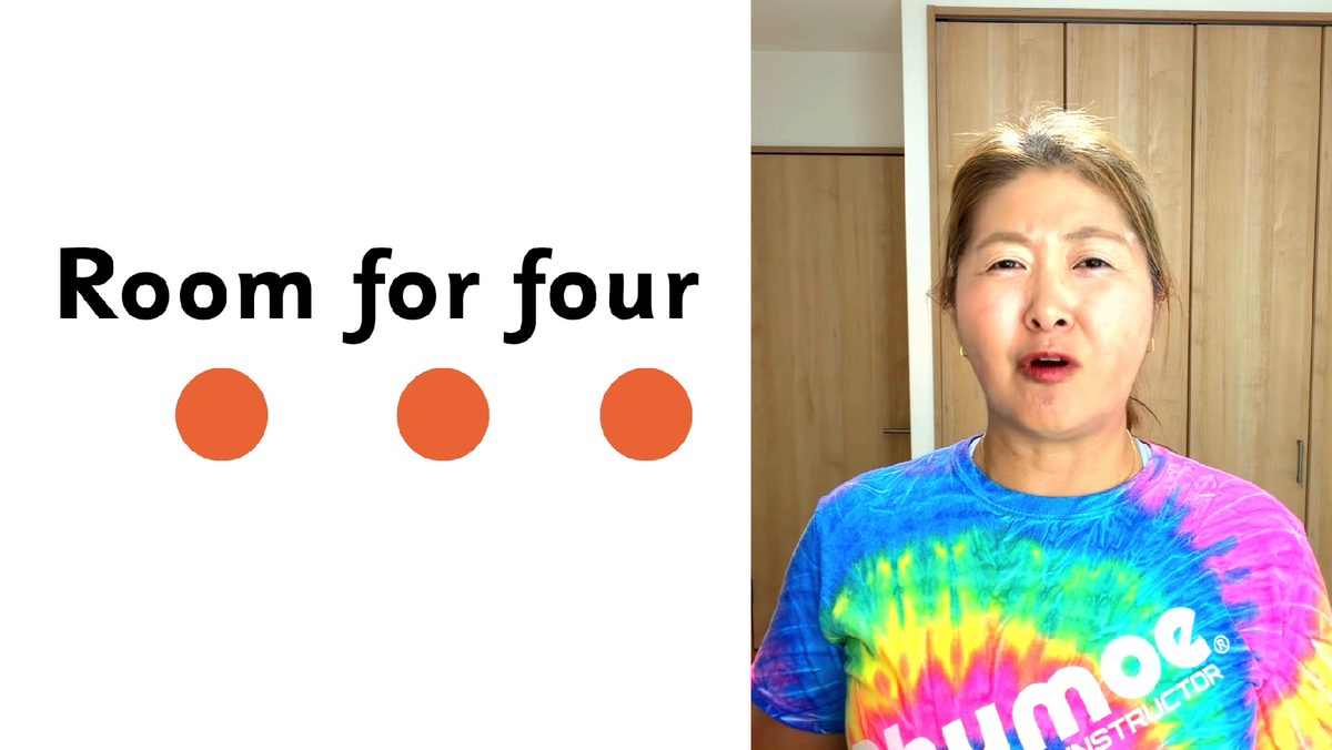「Room for four」のスライドの横で話す講師の石川良美